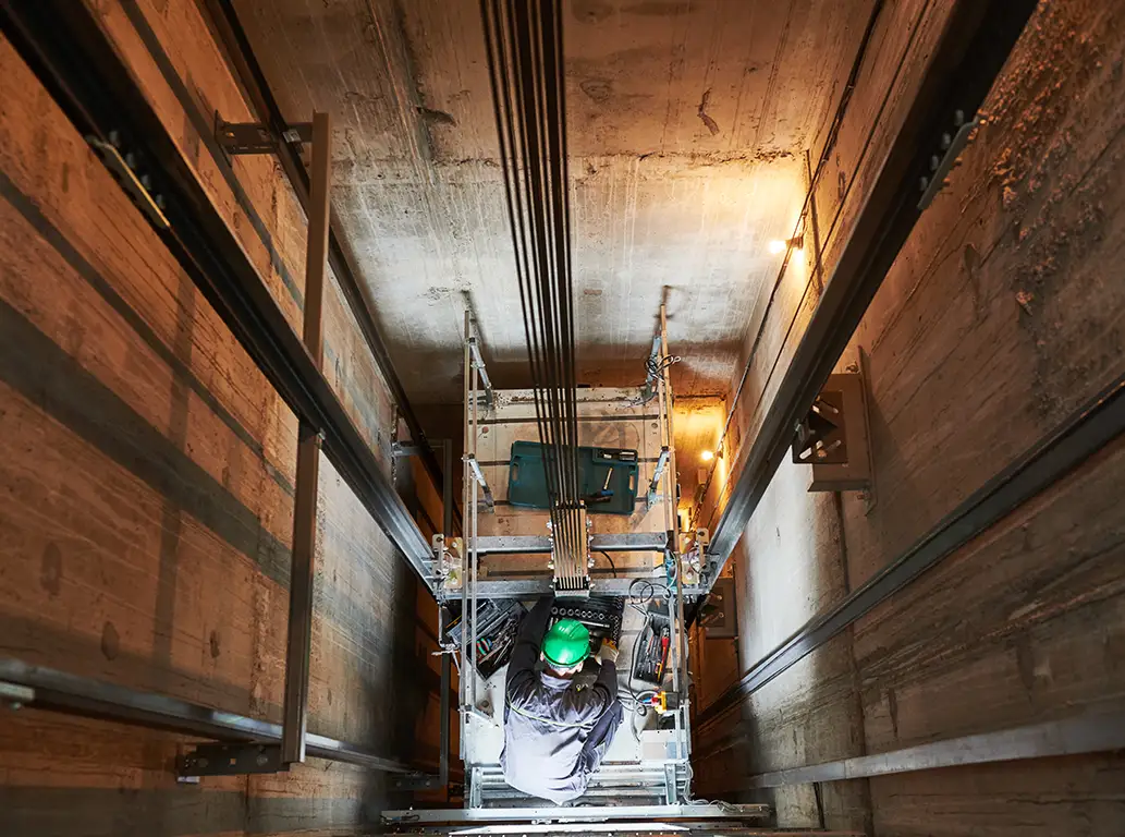 Lift elevator installation in a concrete lift shaft by one of the team, showcasing a key service provided by The Luxury Lift Company for lift projects